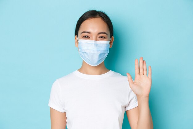 Asian female in casual T-shirt posing