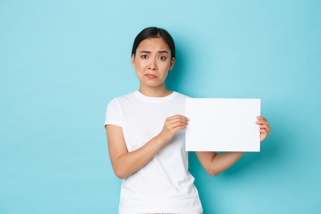 Asian female in casual T-shirt posing