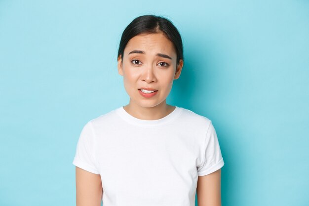 Asian female in casual T-shirt posing