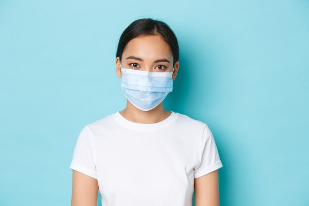 Asian female in casual T-shirt posing