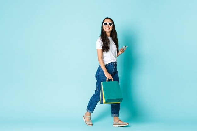 Asian female in casual T-shirt posing