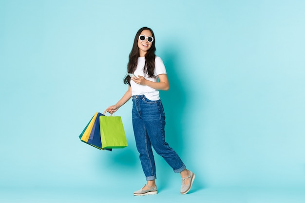 Asian female in casual T-shirt posing