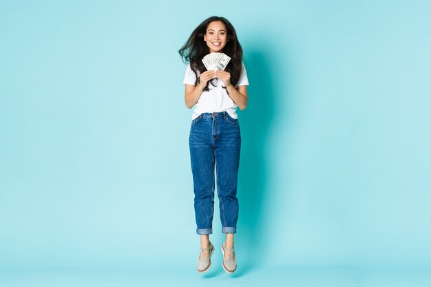 Asian female in casual T-shirt posing