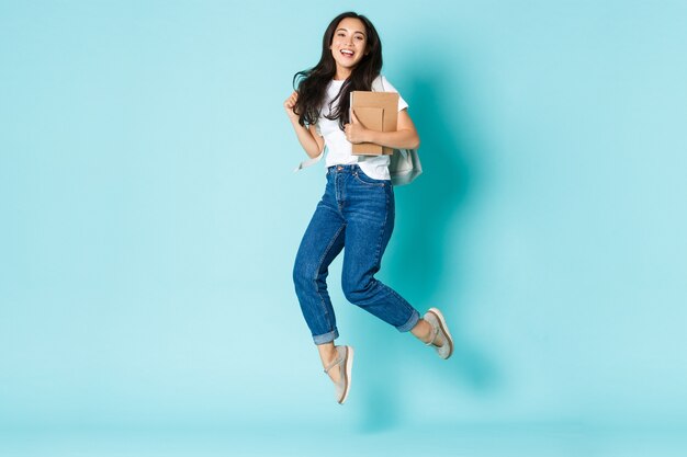 Asian female in casual T-shirt posing