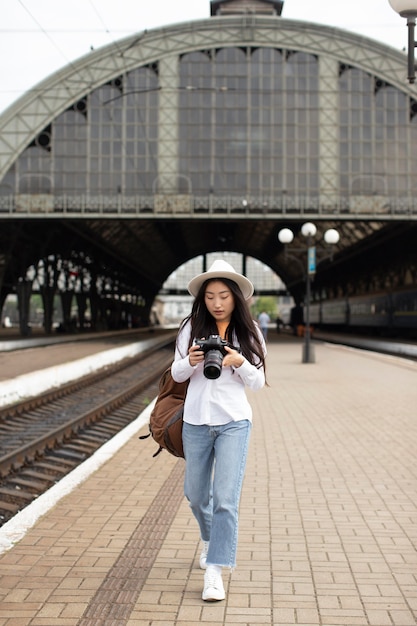 Asian female local traveler with a camera