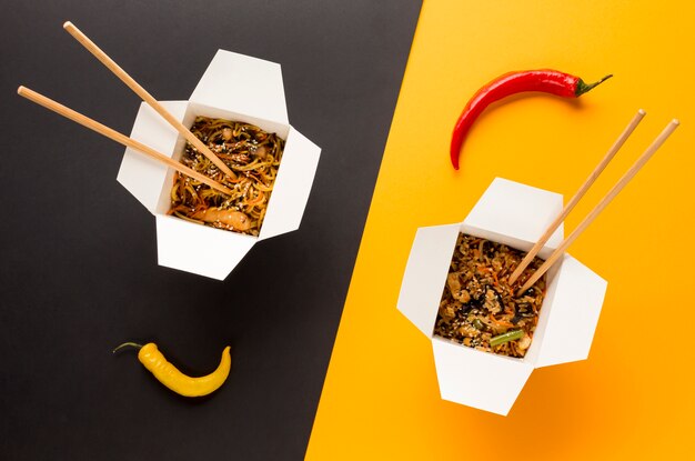 Asian food with chopsticks top view