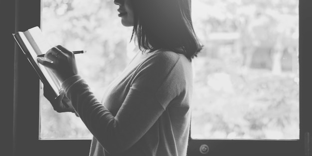 Asian Lady Writing Notebook Diary Concept