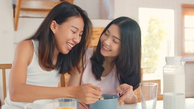 Asian Lesbian lgbtq women couple have breakfast at home
