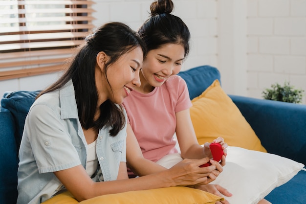 Free photo asian lesbian lgbtq women couple propose at home