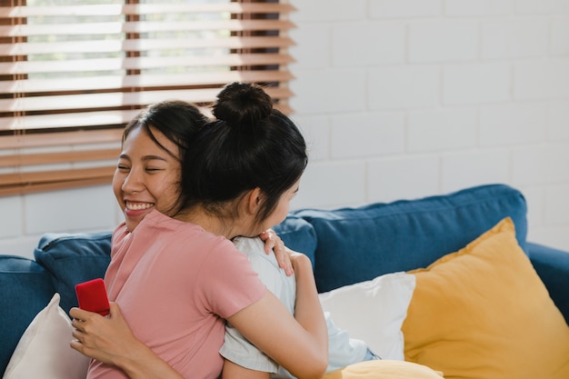 Asian Lesbian lgbtq women couple propose at home