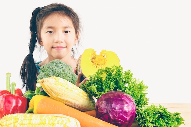 asian lovely girl showing enjoy expression with fresh colorful vegetables 