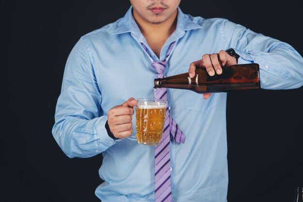 asian man drinking a beer mug