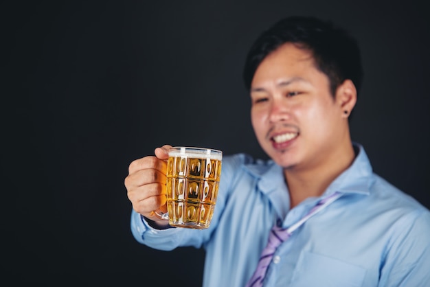 asian man drinking a beer mug