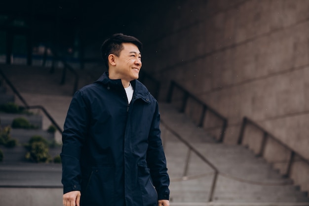 Asian man tourist walking outside the street