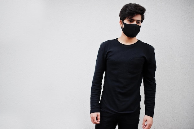 Asian man wear all black with face mask isolated on white background