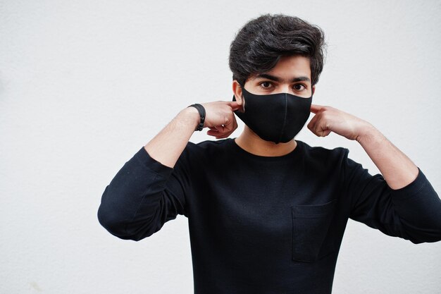 Asian man wear all black with face mask isolated on white background