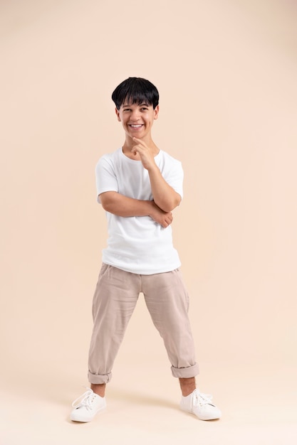 Asian man in a white shirt with dwarfism posing