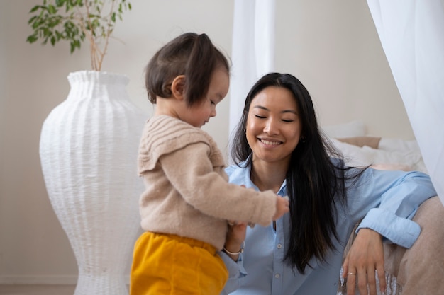 Asian mother and daughter spending time together at home