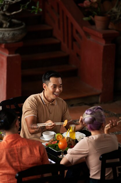 Asian people having dinner party