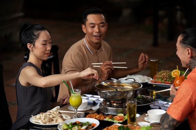 Asian people having dinner party