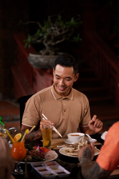 Asian people having dinner party