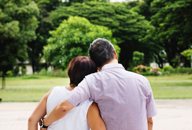 Asian senior couple in the park rear view free image