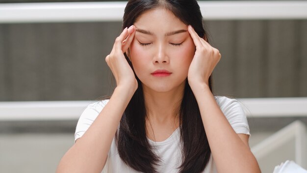 Asian student woman read books in library at university