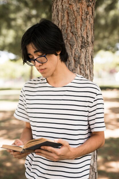 Asian teenage student reading book