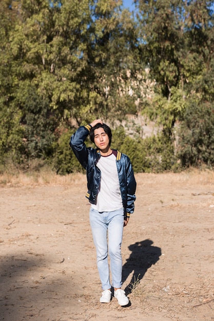 Asian teenager walking in park