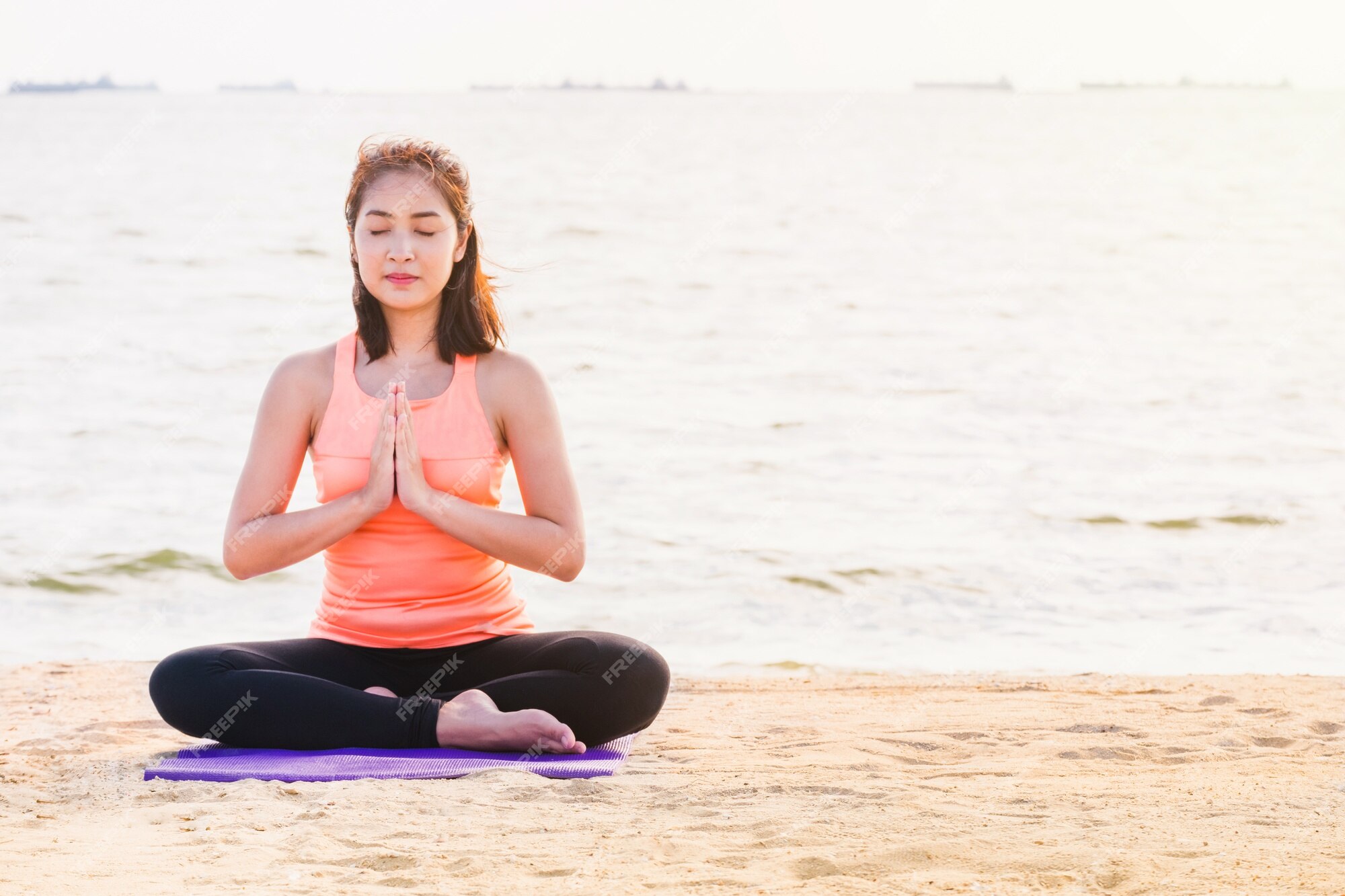 Premium Photo Asian woman close eyes and doing hand namaste yoga pose and m...