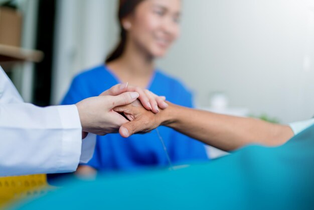 Asian woman doctor encouragement and supportive to cansor patient after consult and examine in clinic hospital health ideas concept