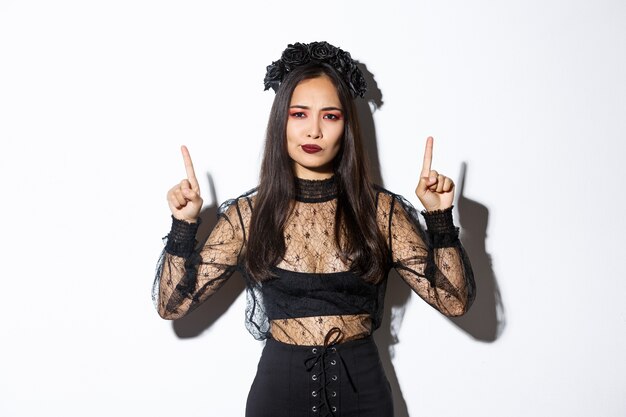 Asian woman in Halloween costume posing