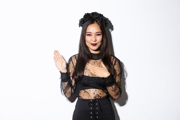 Asian woman in Halloween costume posing