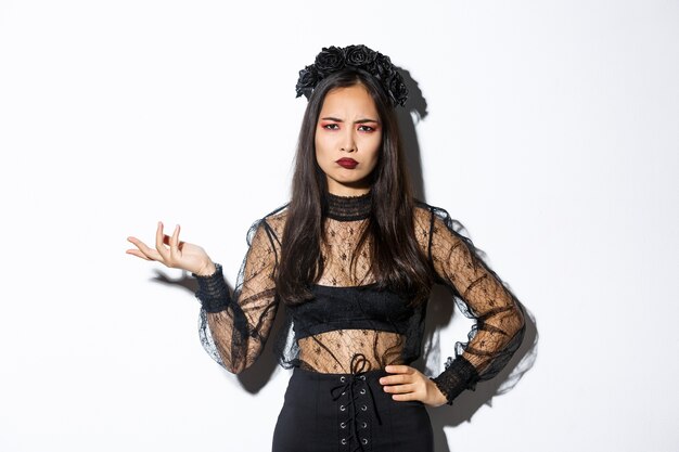 Asian woman in Halloween costume posing