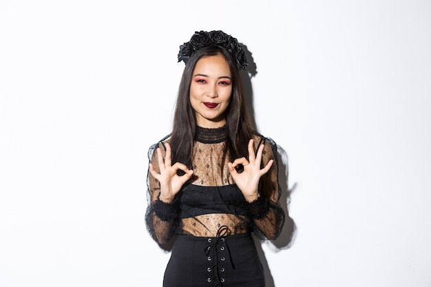 Free photo asian woman in halloween costume posing