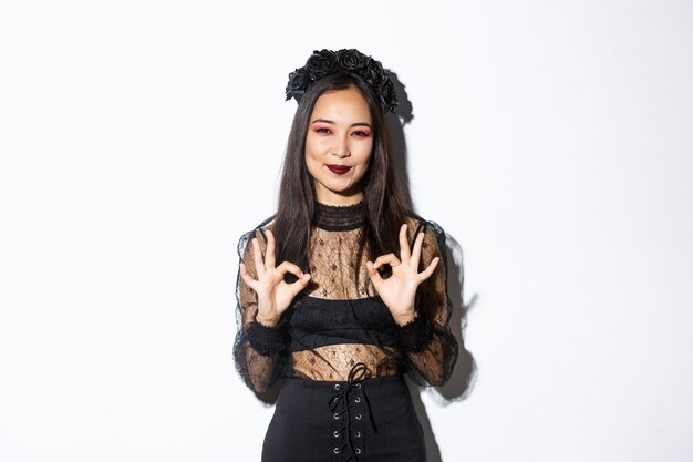 Asian woman in Halloween costume posing