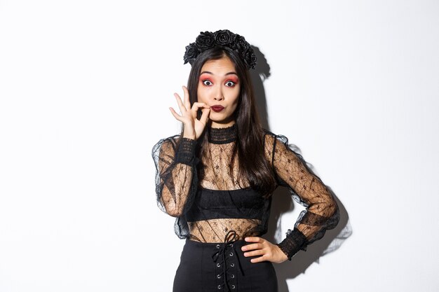 Asian woman in Halloween costume posing