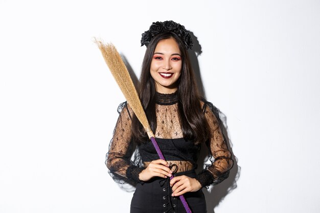 Asian woman in Halloween costume posing