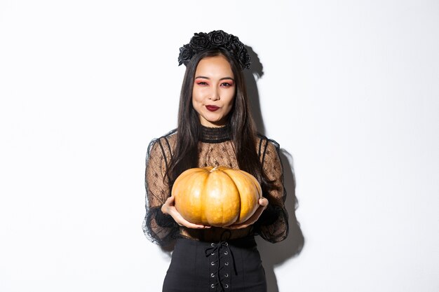 Asian woman in Halloween costume posing