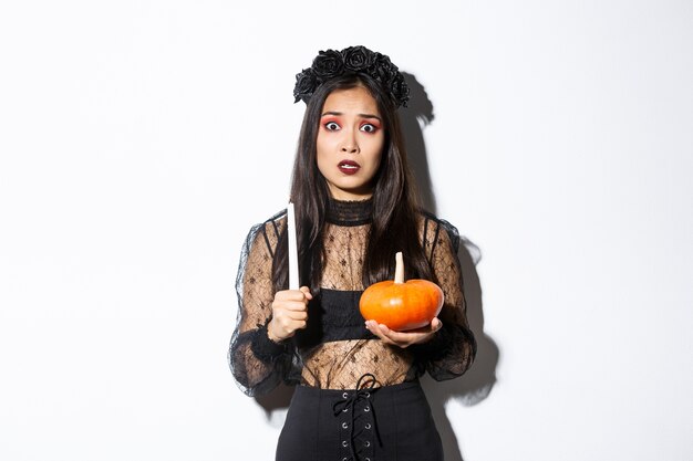 Asian woman in Halloween costume posing