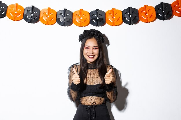 Free photo asian woman in halloween costume posing