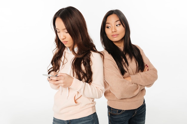 Asian woman looking at her sister