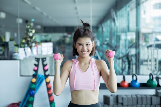 asian woman play fitness in the gym