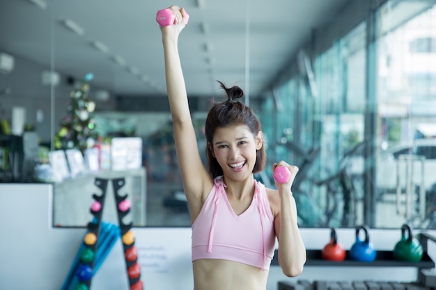 asian woman play fitness in the gym