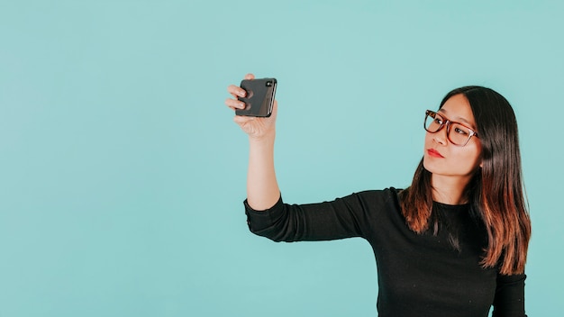 Asian woman posing for selfie