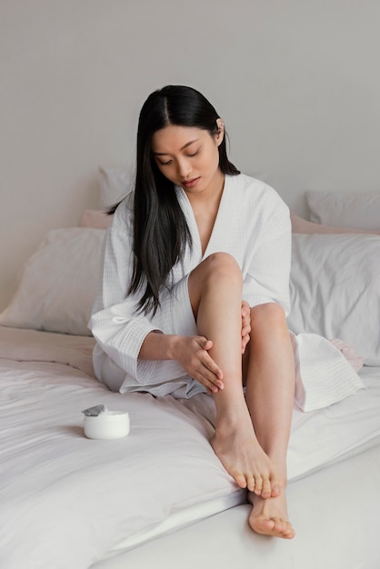 Free photo asian woman relaxing at home