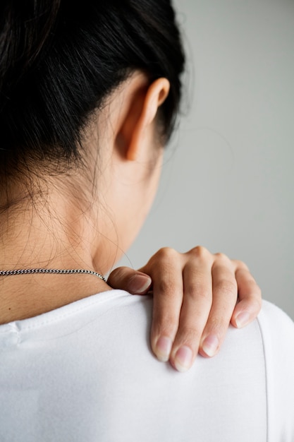 Free photo asian woman suffering back pain