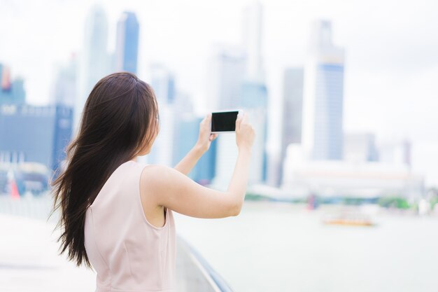 Asian woman using smartphone or mobile phone 