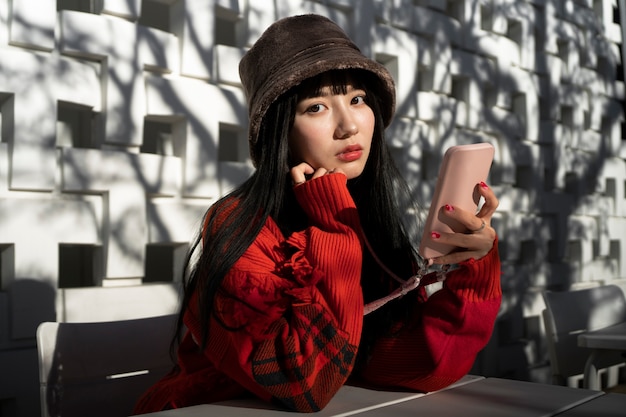 Asian woman wearing bucket hat medium shot