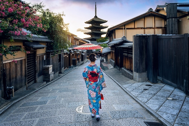 Asian woman wearing japanese traditional kimono at Yasaka Pagoda and Sannen Zaka Street in Kyoto, Japan.